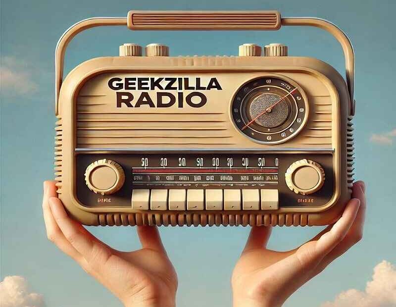 Hands holding a vintage-style beige radio labeled 'Geekzilla Radio' against a clear blue sky, showcasing a retro design with dials and buttons.