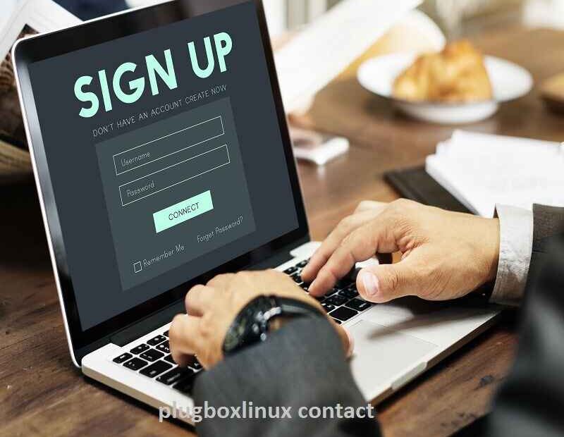 User signing up on a laptop screen displaying a sign-up form, illustrating PlugBoxLinux contact and support options.