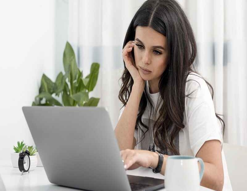 Girl working on laptop with his full intelligence.